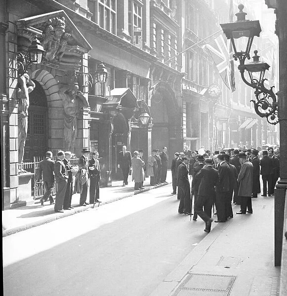 Stockbrokers and stock jobbers seen here outside the London Stock Exchange before
