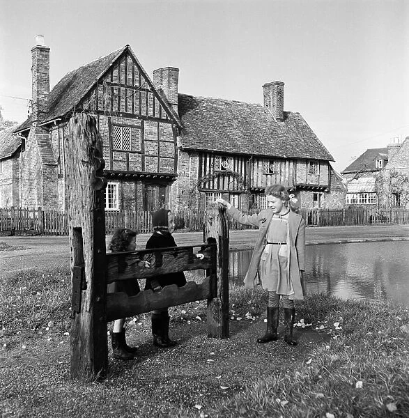 The stocks at Aldbury, Hertfordshire. Circa 1950