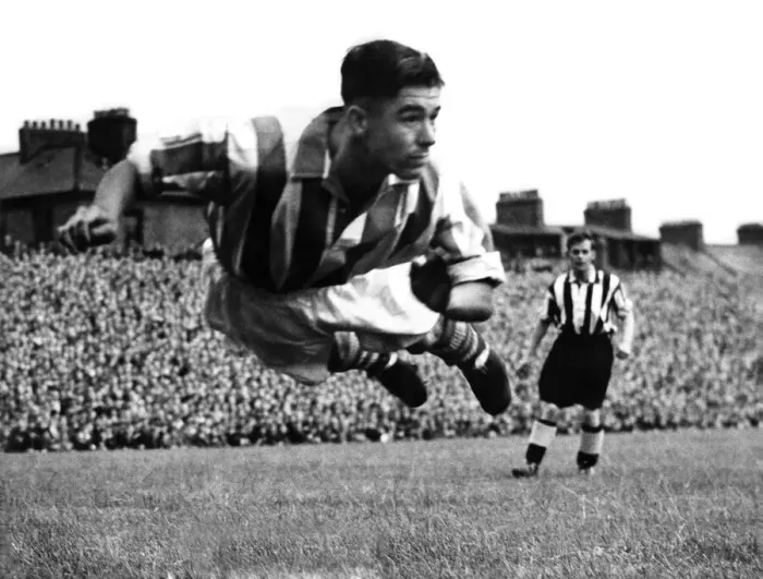 Framed Print : Stoke centre-half Frank Mountford diving to head away a George Robledo shot at Newcastle