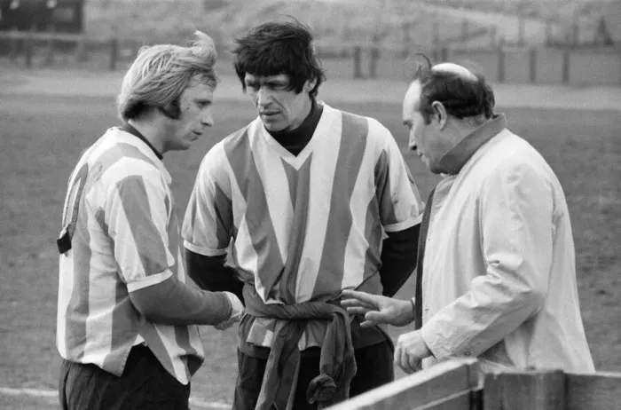 Framed Print : Stoke City players receive some last minute instructions from manager Tony Waddington