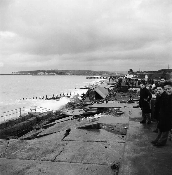 Storm damage on the promenade at Seaford. Fierce gales have swept the British Isles