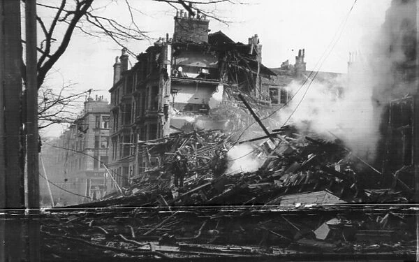 A four story house, now a wreck after it was hit in a German Air raid