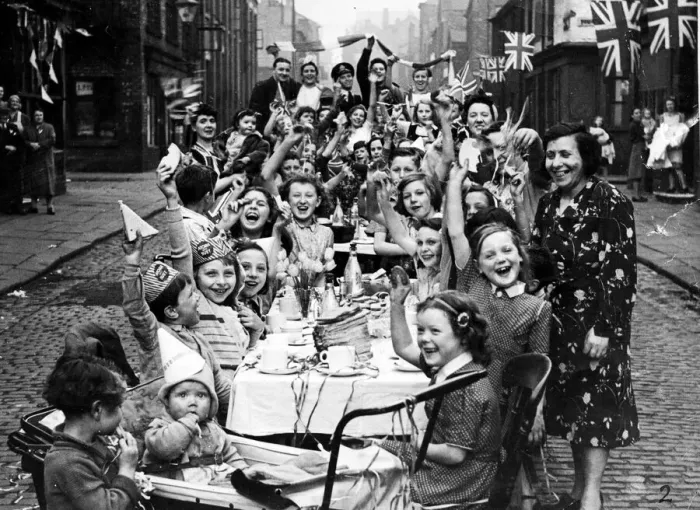 Framed Print : Streamers and flags are waved by residents of this Manchester street when fifty children Framed Print : Streamers and flags are waved by residents of this Manchester street when fifty children