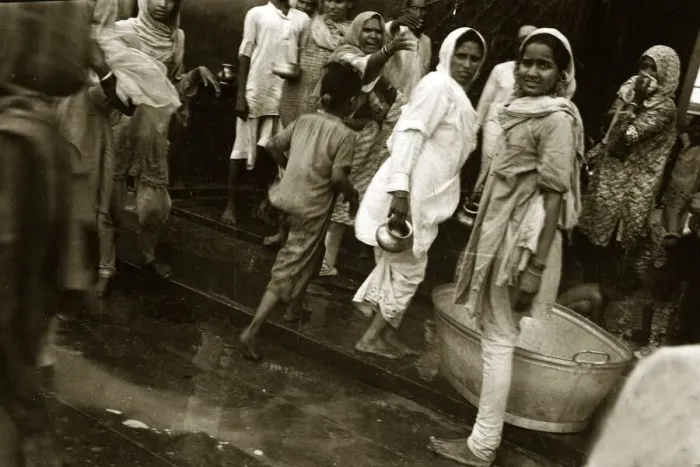 Framed Print : A street scene in India - Women going about doing their daily tasks wearing traditional Framed Print : A street scene in India - Women going about doing their daily tasks wearing traditional