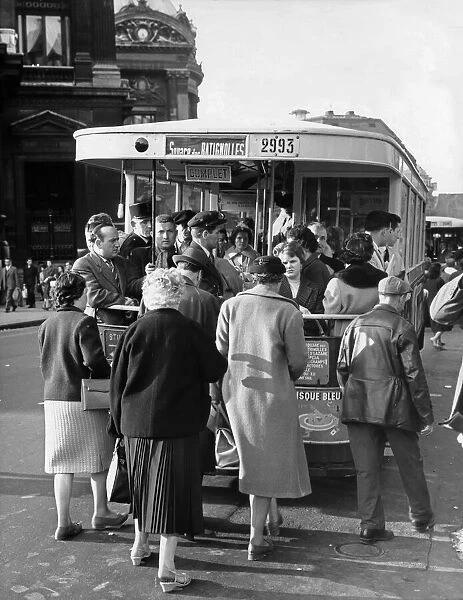 Street scene in Paris showing customers on board the bus bound for Square Des Batignolles