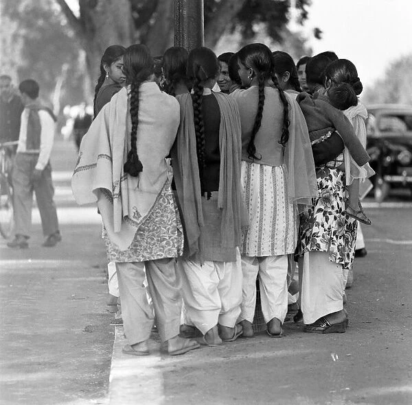 Street scenes, New Delhi, India, January 1961. Young group of girls wait for