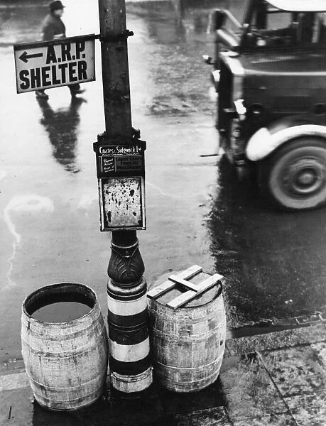 A street in Stockton on Tees. A barrel of water, and a barrel of sand