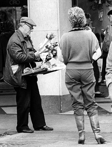A street trader selling flowers on Northumberland Street, Newcastle on 19th October 1984