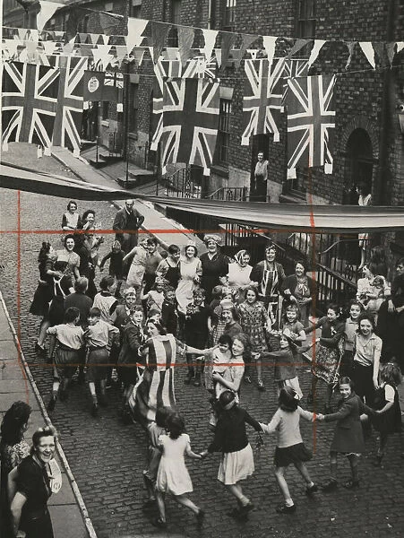 How the back streets of Manchester danced, the day before VE Day. 7th May 1945