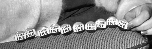 A string of I Like Ike badges The slogan 'I Like Ike'was created when Peter G
