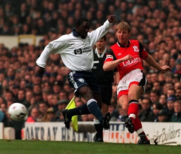 Stuart Pearce of Nottingham Forest shoots past Ruel Fox of Tottenham during FA Cup Replay
