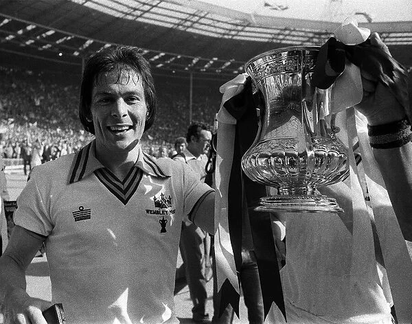 Stuart Pearson of West Ham holds the FA Cup after West Ham had beaten Arsenal in