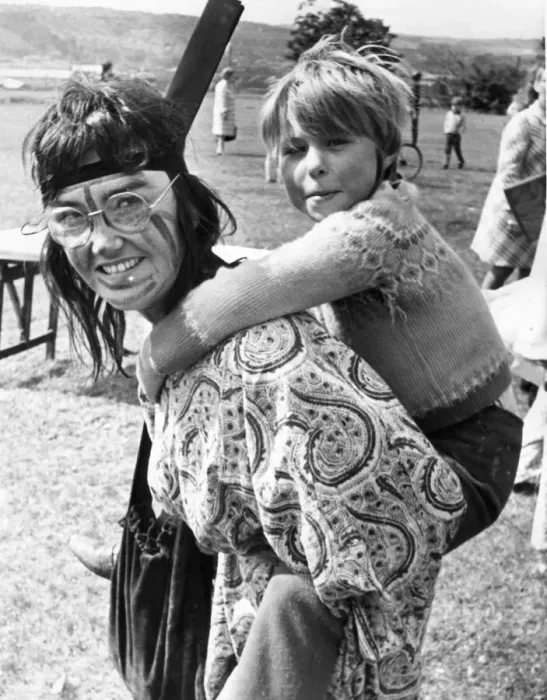 Framed Print : Student colunteer Liz Whybrow gives a piggy-back to Tracy Dishman, 7