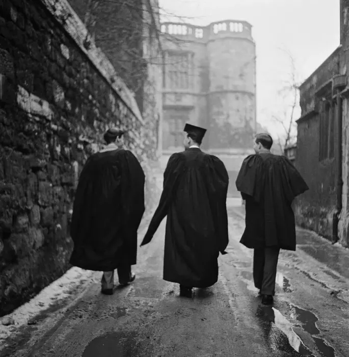 Framed Print : Student of Oxford University walking through one of the narrow back streets of the town Framed Print : Student of Oxford University walking through one of the narrow back streets of the town