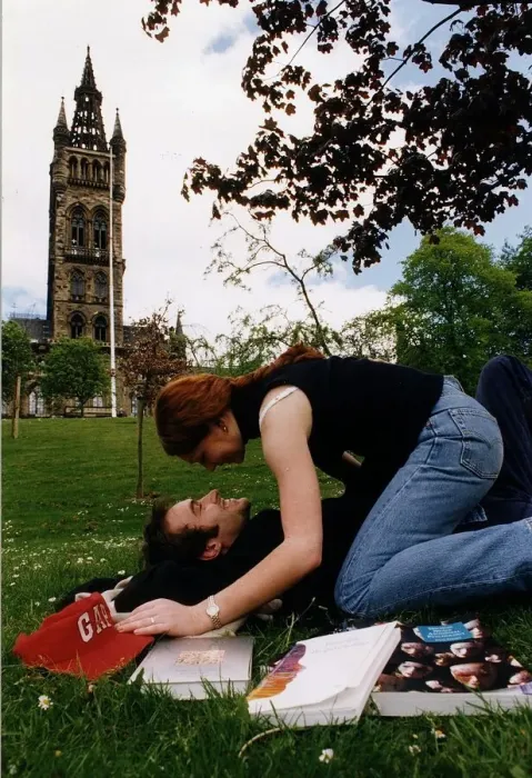 Framed Print : Students lay on the grass on campus kissing Framed Print : Students lay on the grass on campus kissing
