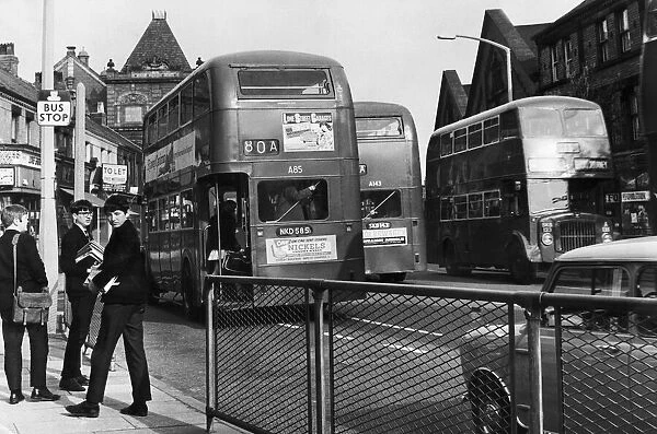Students of Liverpool University waiting at the bus stop on the Smithdown Road