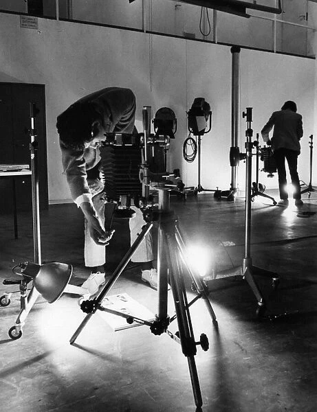 Students at work in one of the high roofed photographic studios at Coventry College of