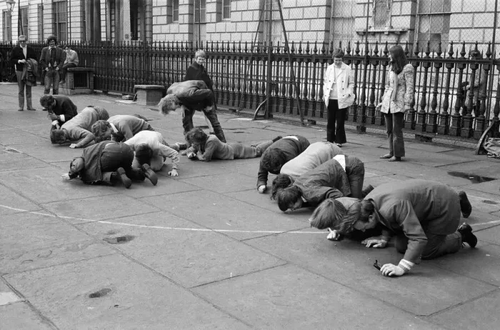 Framed Print : Students and young people taking part in a pea pushing contest for the charity Framed Print : Students and young people taking part in a pea pushing contest for the charity
