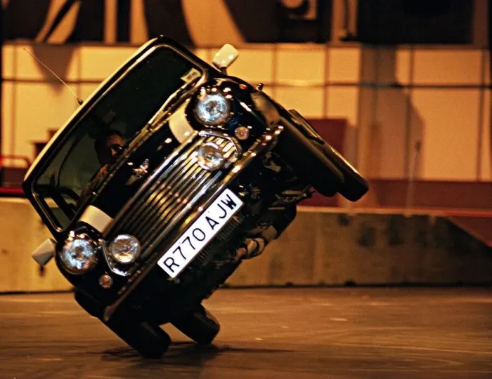 Framed Print : Stunt driver performs a stunt in a mini cooper motor car at the Exhibition Centre for Framed Print : Stunt driver performs a stunt in a mini cooper motor car at the Exhibition Centre for