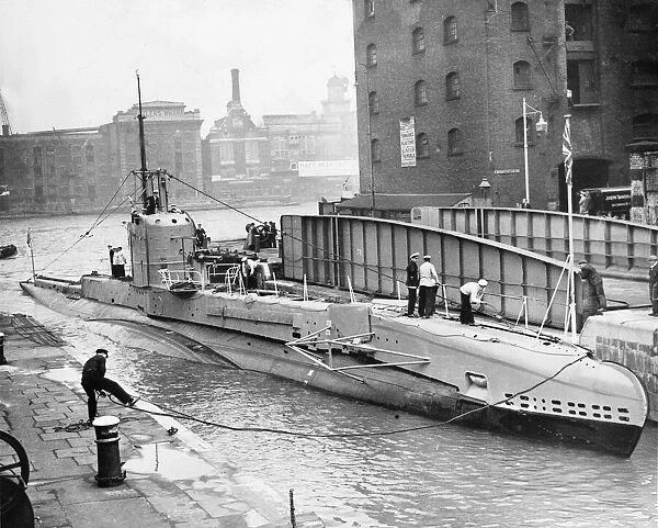 The Submarine Swordfish entering St Catherines Dock from The River Thames