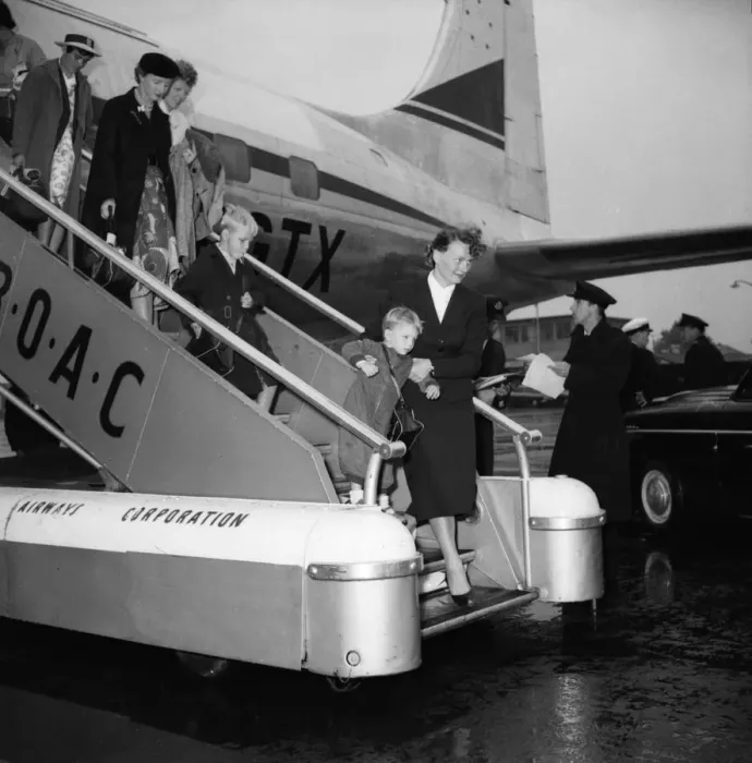 Framed Print : Suez Crisis 1956 British civillians return to a wet United Kingdom after leaving Framed Print : Suez Crisis 1956 British civillians return to a wet United Kingdom after leaving