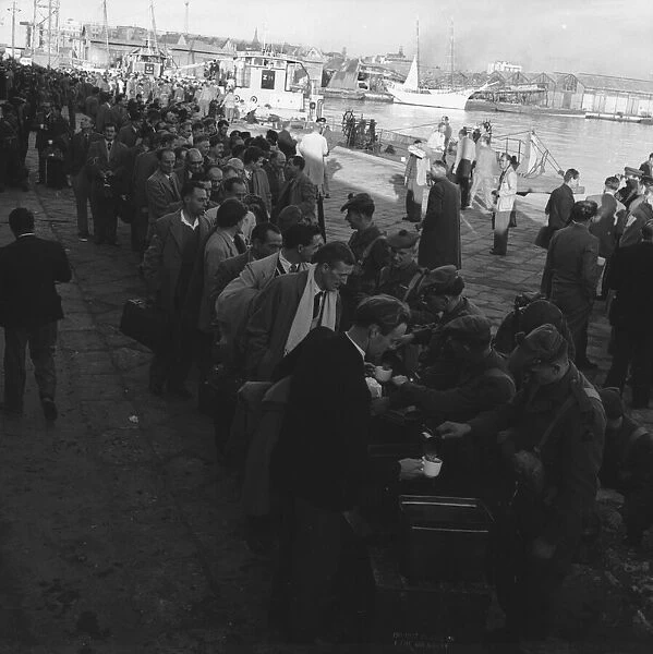 Suez Crisis 1956 British evacuees who have been brought from Cairo line up for a