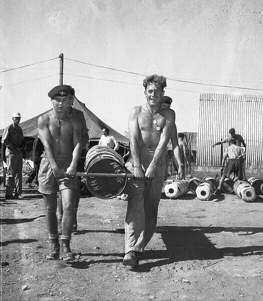 Suez Crisis 1956 British Paratroopers in Cyprus loading canisters with equipment to