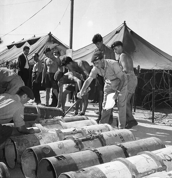Suez Crisis 1956 British Paratroopers in Cyprus loading canisters with equipment to