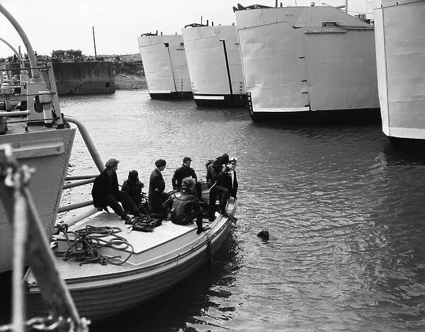 Suez Crisis 1956 - British ships at anchor are checked being checked by divers
