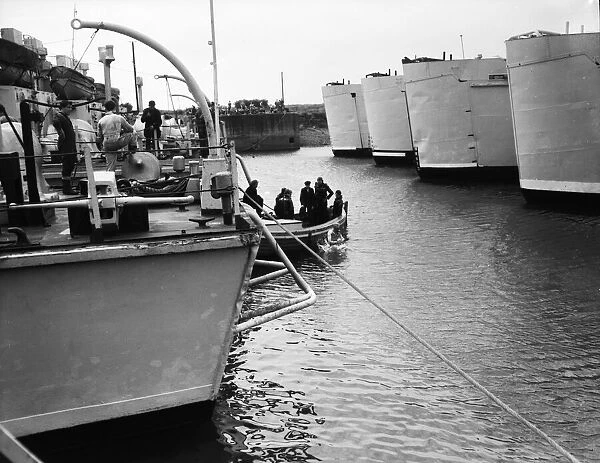 Suez Crisis 1956 - British ships at anchor are checked by divers in readiness for