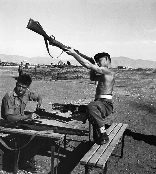 Suez Crisis 1956 British soldiers clean their weapons on an airfield in Cyprus