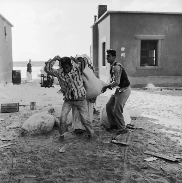 Framed Print : Suez Crisis 1956 Children carry off the leftovers after adults raided Framed Print : Suez Crisis 1956 Children carry off the leftovers after adults raided