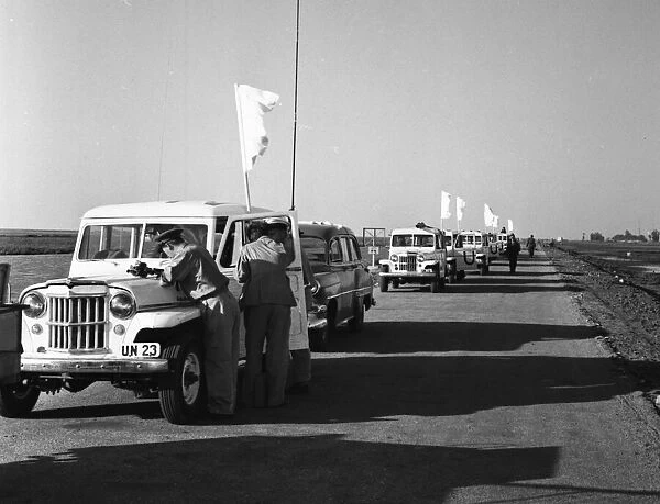 Suez Crisis 1956 Under a flag of truce UNO vehicles prepare to drive through