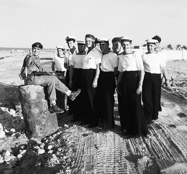 Suez Crisis 1956 Sailors on shore leave are given directions on the coast road near