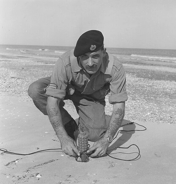 Suez Crisis 1956 Seargent Bill Kidd of the Royal Engineers prepares a mine for