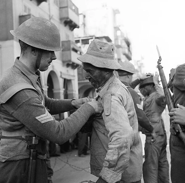 Suez Crisis 1956 Troops assisted by CID officers from Cyprus search Arab Town