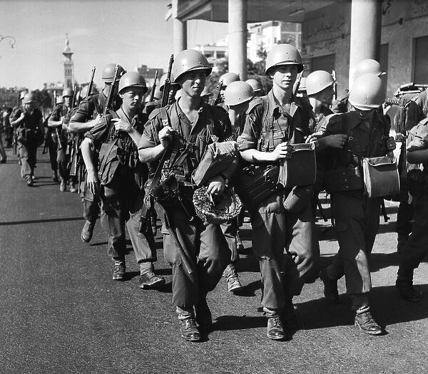 Suez Crisis 1956 United Nations troops march into Port Said past a restless