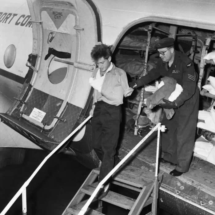 Framed Print : Suez Crisis 1956 A wounded British soldier is helped off an ambulance aircraft Framed Print : Suez Crisis 1956 A wounded British soldier is helped off an ambulance aircraft