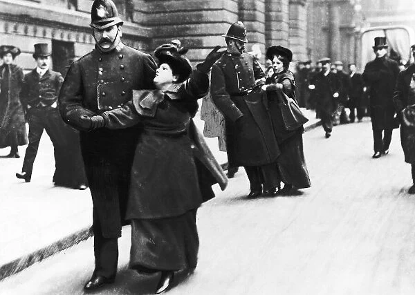 Suffragettes Under Arrest May 1906 Pictured being escorted by Policemen in London