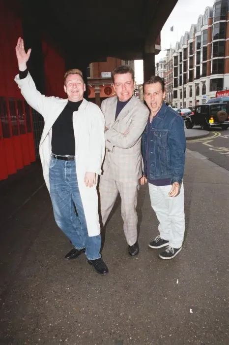 Framed Print : Suggs, lead singer of British ska group Madness, with two members of the group posing for Framed Print : Suggs, lead singer of British ska group Madness, with two members of the group posing for