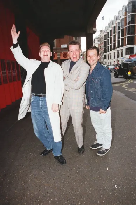 Framed Print : Suggs, lead singer of British ska group Madness, with two members of the group posing for Framed Print : Suggs, lead singer of British ska group Madness, with two members of the group posing for