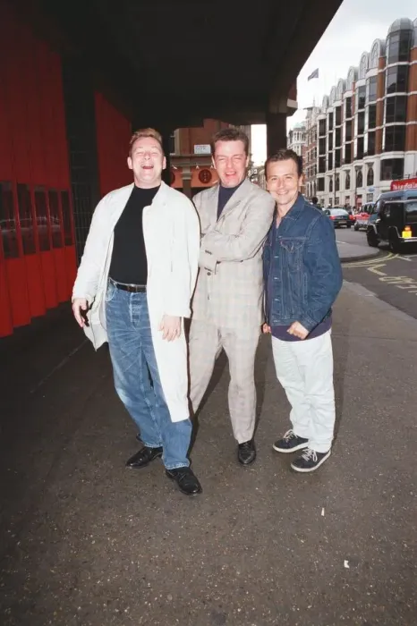 Framed Print : Suggs, lead singer of British ska group Madness, with two members of the group posing for Framed Print : Suggs, lead singer of British ska group Madness, with two members of the group posing for