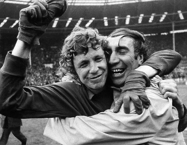 Sunderland manager Bob Stokoe hugs his goalkeeper Jim Montgomery who performed heroics to