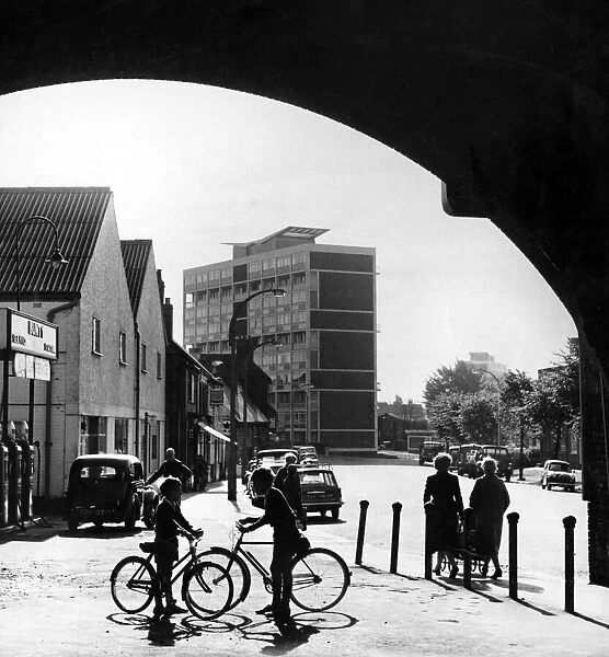 A sunny morning at Spon End, Coventry, with the railway bridge framing modern blocks of