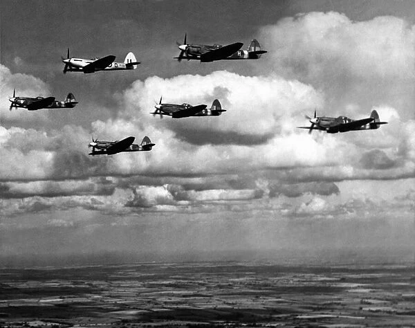 Supermarine Spitfire F22 s, of RAF Ouston, in flight rehearsing for the 10th