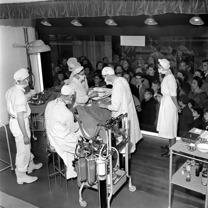 Framed Print : Surgical operation and how a operating theatre works is demonstrated to members of Framed Print : Surgical operation and how a operating theatre works is demonstrated to members of