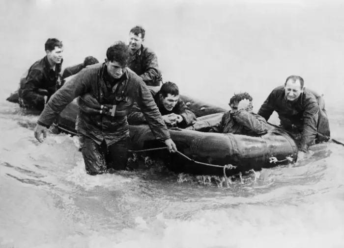 Framed Print : Survivors of a landing craft off the coast of France came safely ashore in a rubber life Framed Print : Survivors of a landing craft off the coast of France came safely ashore in a rubber life