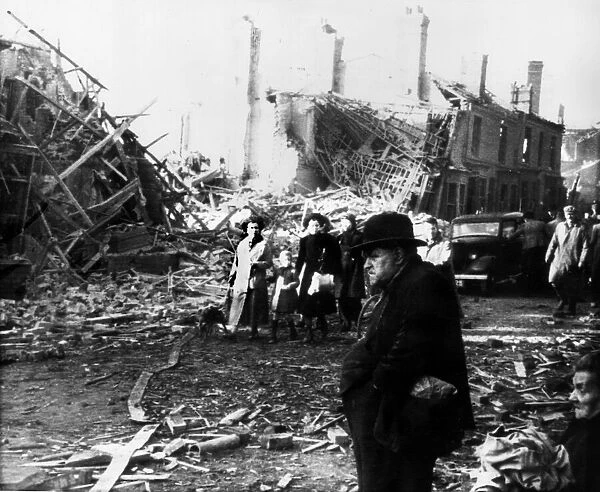 Survivors from the previous nights bombing seen here walking through the wreckage of