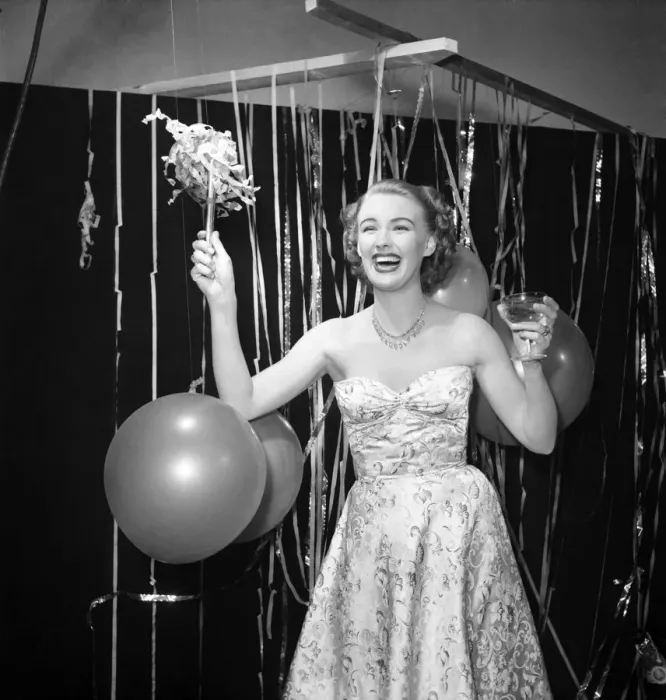 Framed Print : Susan celebrates the New Year with champagne and balloons January 1950 Framed Print : Susan celebrates the New Year with champagne and balloons January 1950
