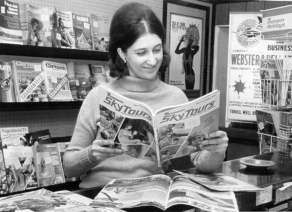 Susan Slater pores over the holiday brochures in a Newcastle Travel Agency